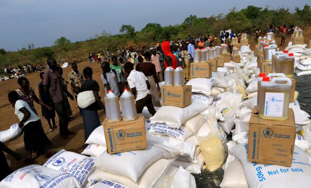 File Photo: South Sudanese Refugees Displaced By Fighting, Receive Food Rations In Imvepi Settlement In Arua District