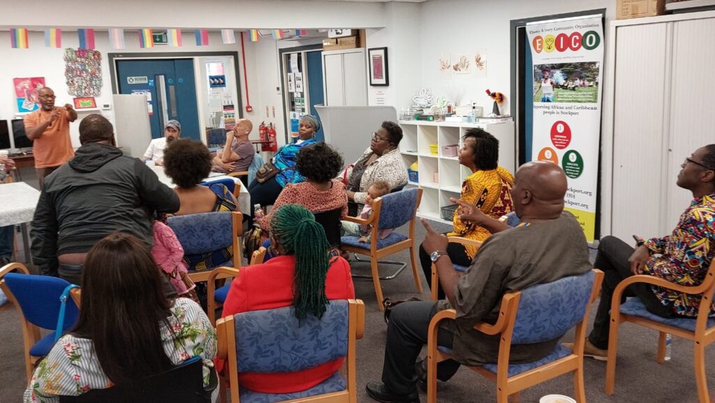Windrush survivors and campaigners at a community event.